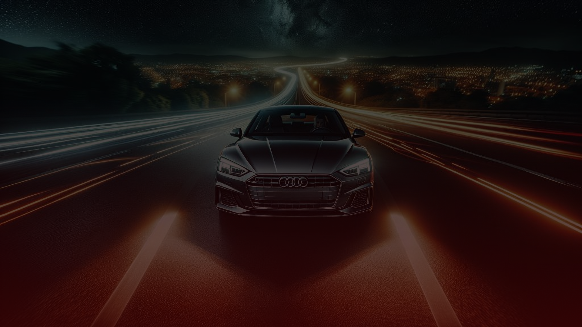 A sleek black car glides through the night on a city road with illuminated Toronto and Guelph lights in the background. The Audis headlights create bright streaks, emphasizing its motion and speed, as if freshly tuned by an expert mechanic. EuroMechanic | Top Reviewed Auto Repair Shop | Greater Toronto and Guelph | Visit Euromechanic