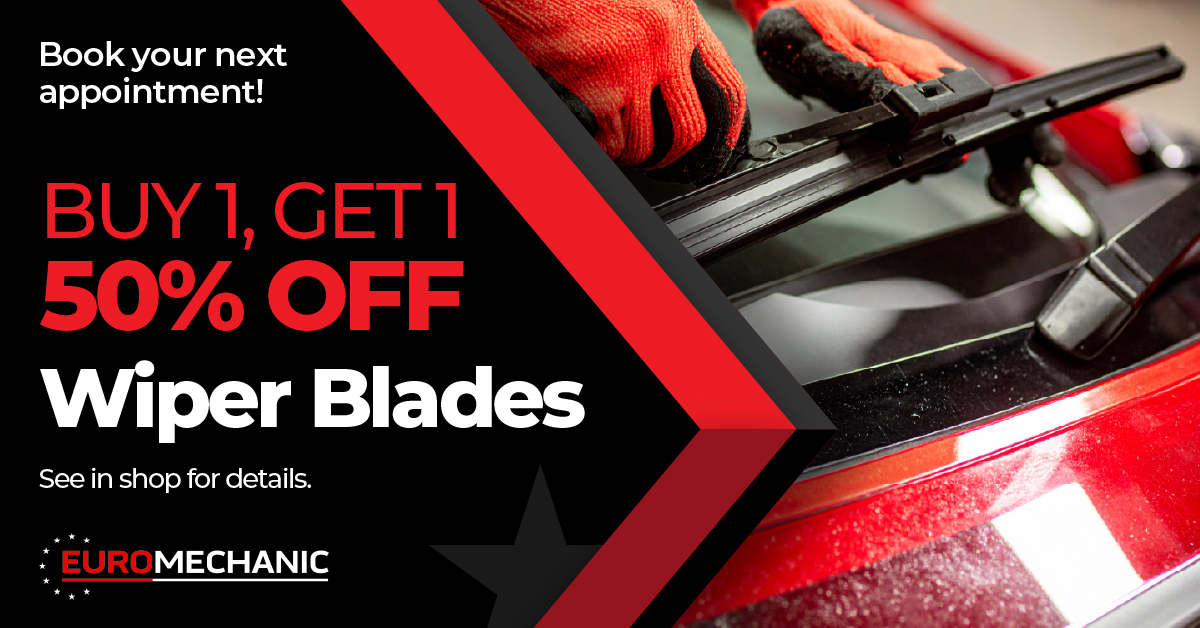 A person wearing orange gloves changes a windshield wiper on a red car. Text reads: “Buy 1, Get 1 50% Off Wiper Blades. See in shop for details. Book your next appointment! Euromechanic.”. EuroMechanic | Top Reviewed Auto Repair Shop | Greater Toronto and Guelph | Visit Euromechanic